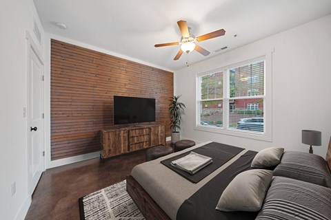 A bedroom with a bed, a tv, and a ceiling fan at Skyloft in Asheville, North Carolina 28803