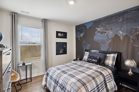 a bedroom with a bed and a map on the wall at Summit Place Apartments, Oak Ridge, TN, 37830
