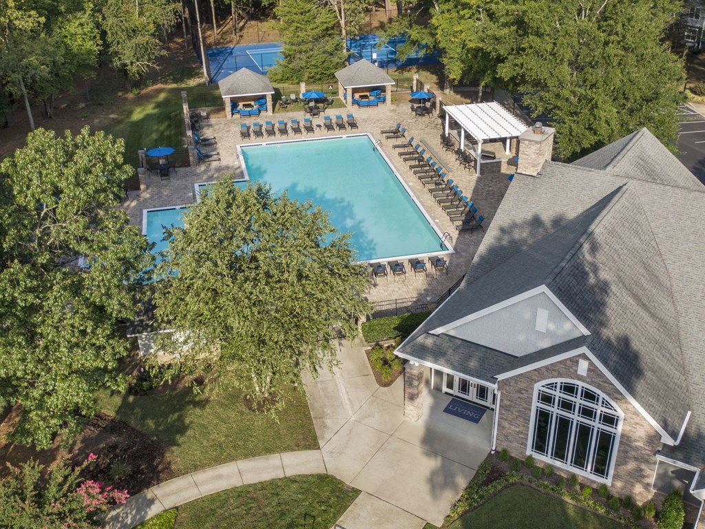 a birdseye view of a pool and a house in a backyard with trees at Trails at Short Pump Apartments, Virginia, 23233