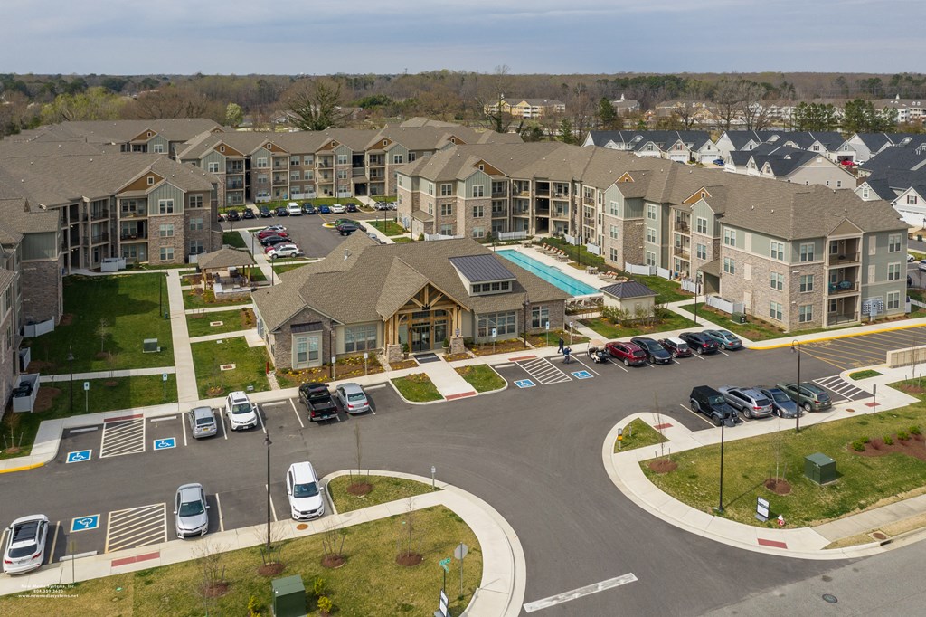 an aerial view of a large apartment complex with a swimming pool at The Whitworth, Virginia, 23185