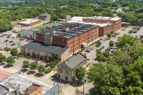 an aerial view of a city with buildings and trees at Mayton Transfer Lofts in Petersburg, VA