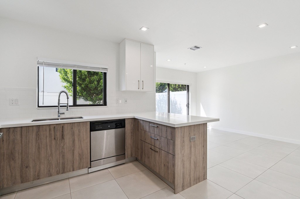 A modern kitchen with a sink and a window.at The Villages at Miami Gardens, Miami Gardens, FL 33056