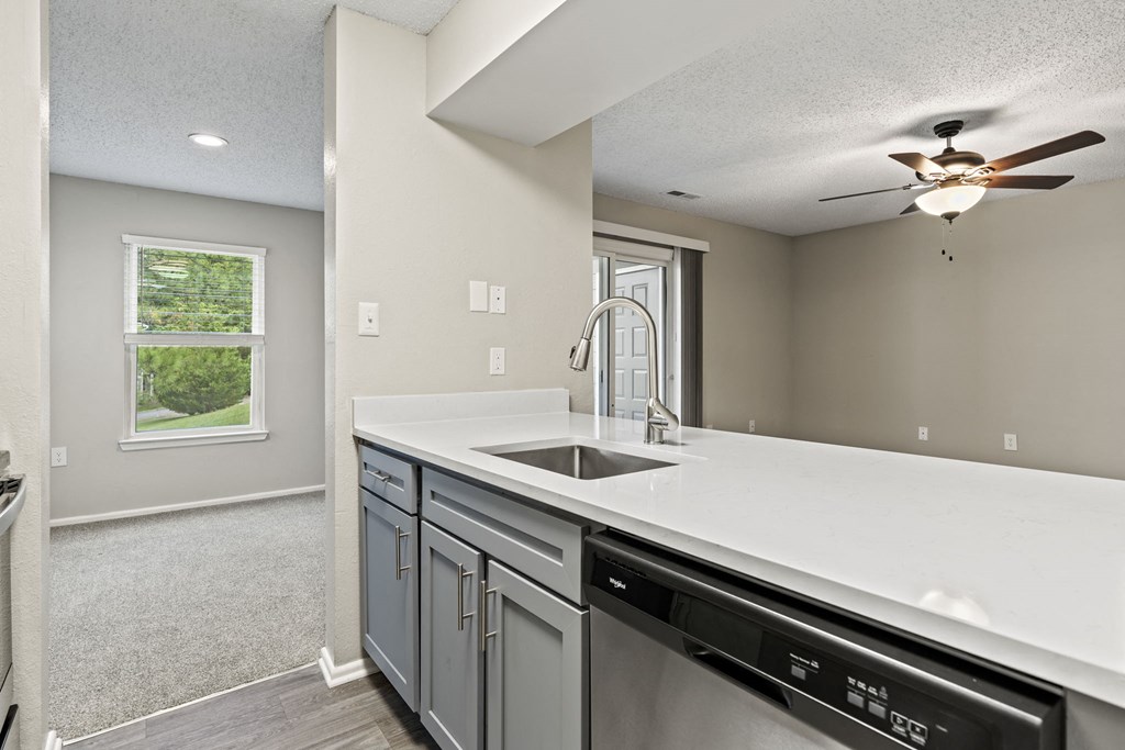 an empty kitchen with a sink and a ceiling fan at Trails at Short Pump Apartments, Richmond, 23233