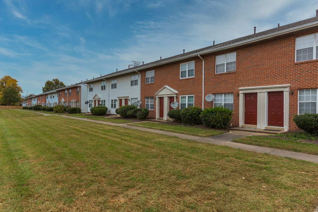 A row of houses with red and white exteriors.