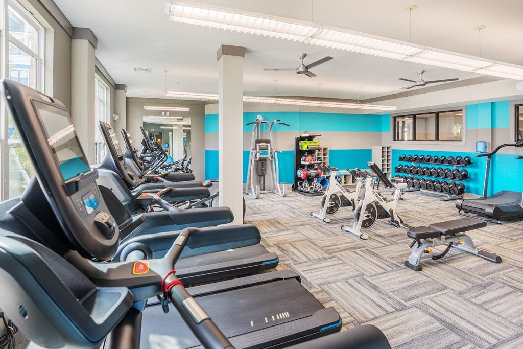 A gym with treadmills and exercise equipment at Streets of Greenbrier, Chesapeake, 23320