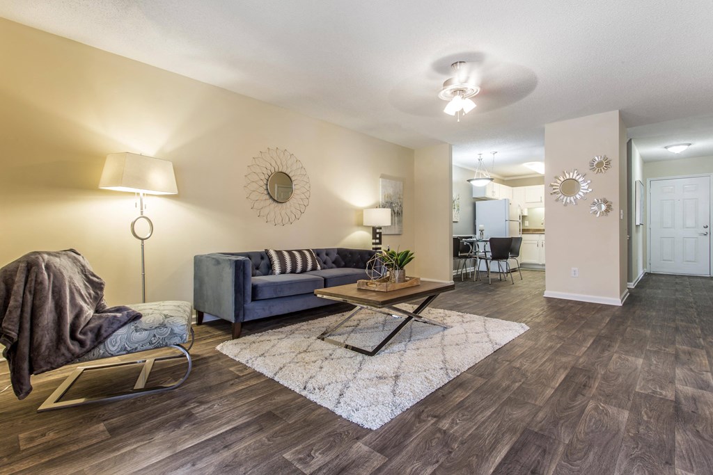 a living room with a couch and a table at Abbington Place Apartments, North Carolina, 27407
