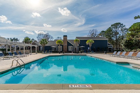 A large swimming pool with a depth marker reading 6 feet.