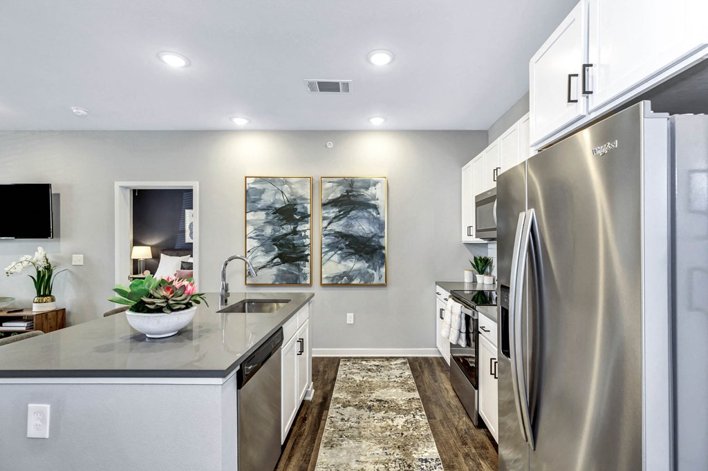 Dining table chair with tv at Farmhaus Apartments, Madison, AL