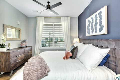 Bedroom with cozy bed at Farmhaus Apartments, Madison