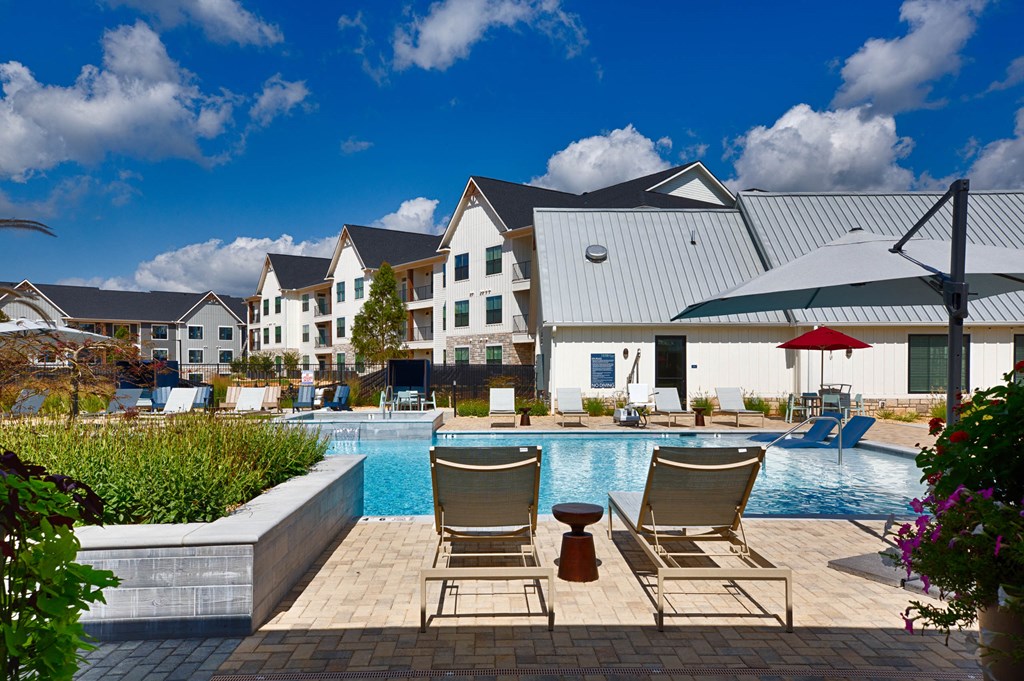 Seating by the pool at Farmhaus Apartments, Madison, AL