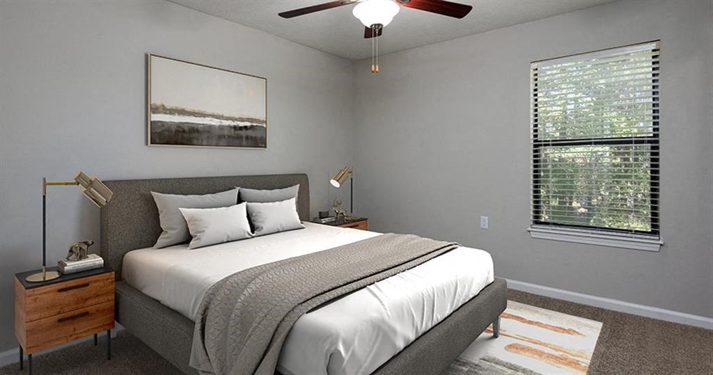 a bedroom with a bed and a ceiling fan at High Ridge Apartments, Athens