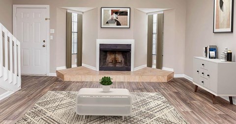 A living room with a fireplace and a rug on the floor.