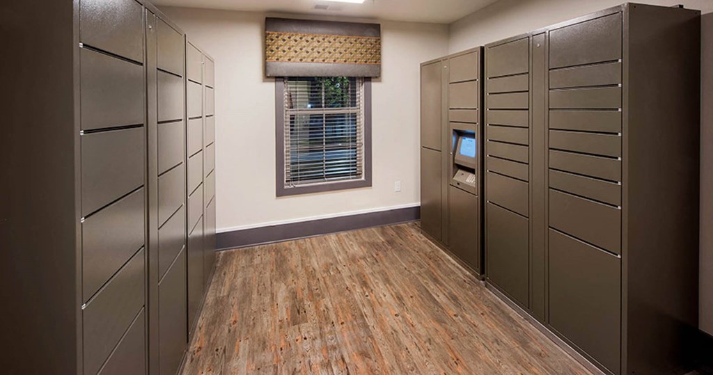 a room with a row of lockers and a window