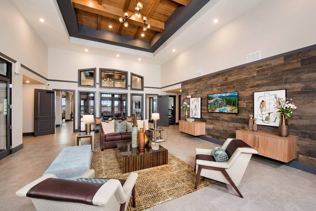 a large living room with furniture and a television