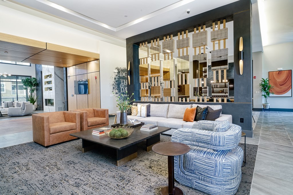 a living room with blue and white furniture and a large window at Lyric at Norton Commons Apartments, Prospect, 40059