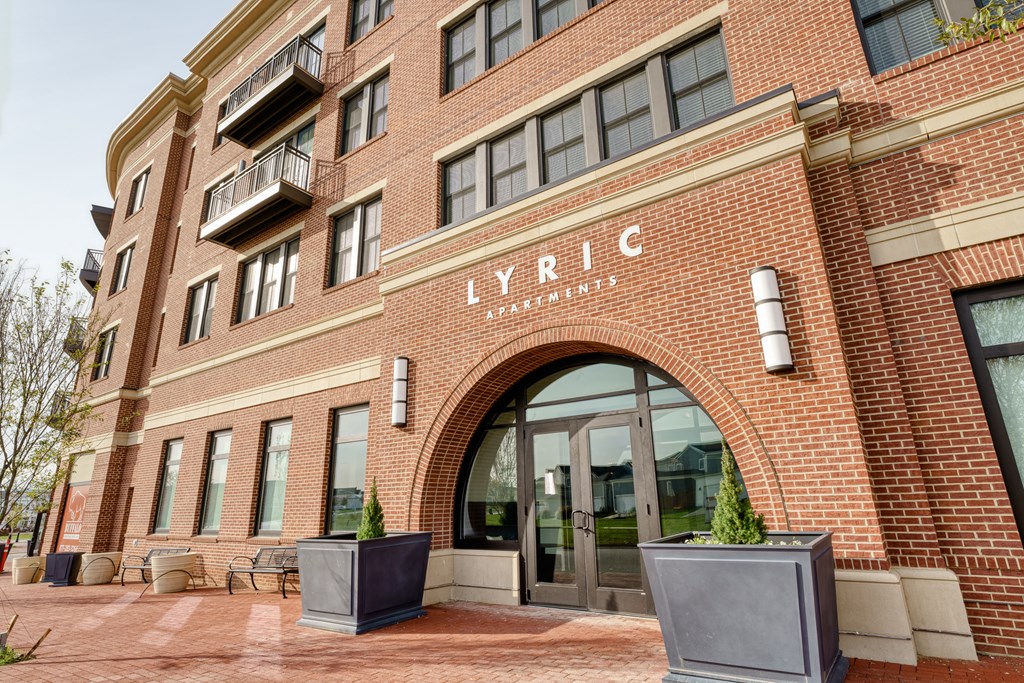 a brick building with an arched door at Lyric at Norton Commons Apartments, Prospect, Kentucky