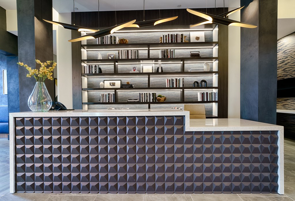 a reception desk with a purple and white design at Lyric at Norton Commons Apartments, Prospect, Kentucky, 40059