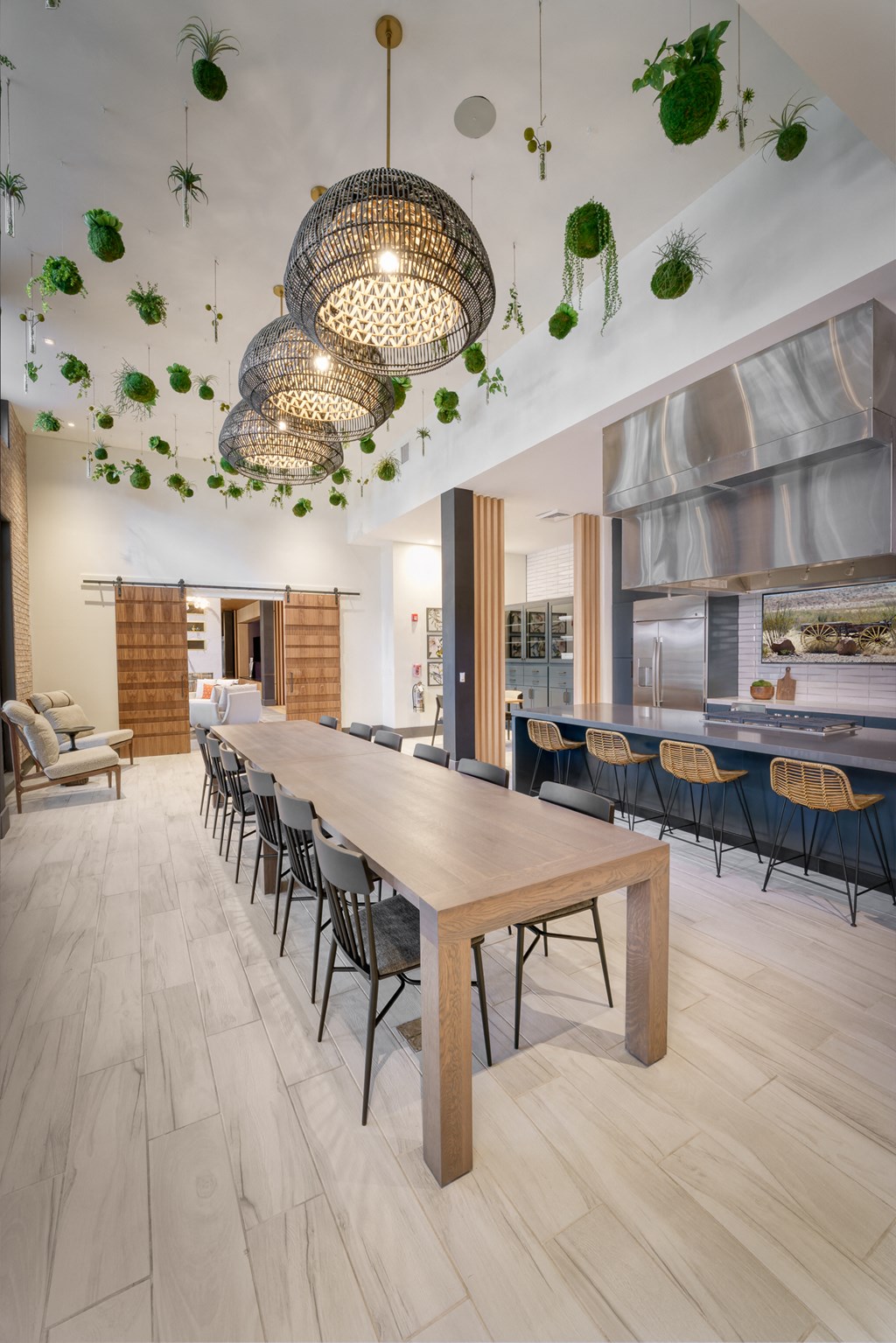 a dining room with a long wooden table and chairs at Lyric at Norton Commons Apartments, Prospect, 40059