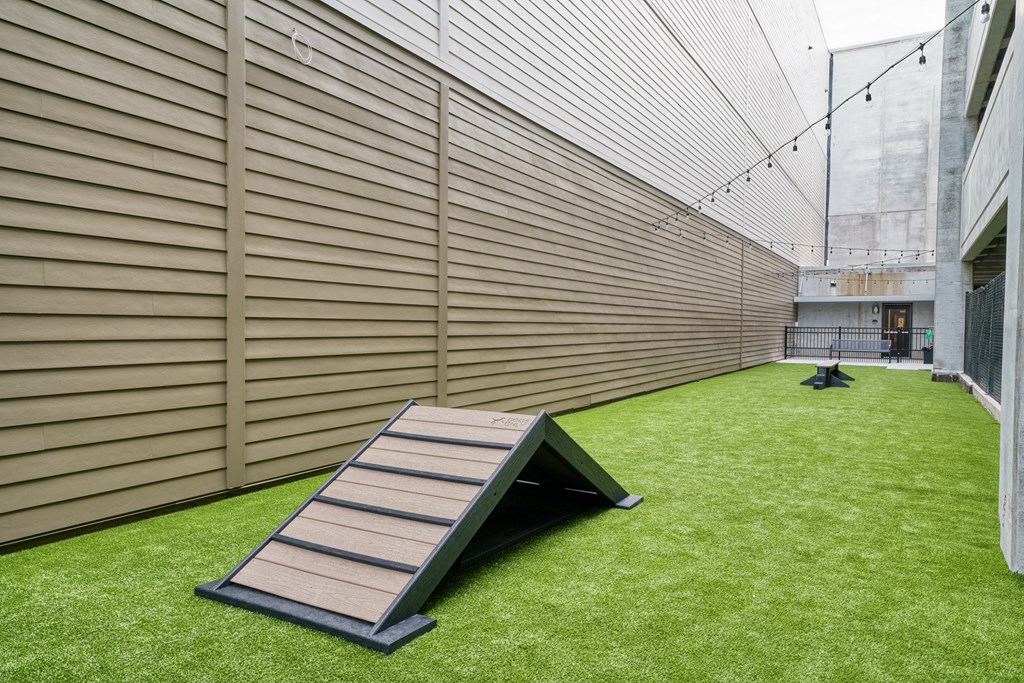 a ramp on the side of a building with grass at Lyric at Norton Commons Apartments, Prospect, Kentucky, 40059