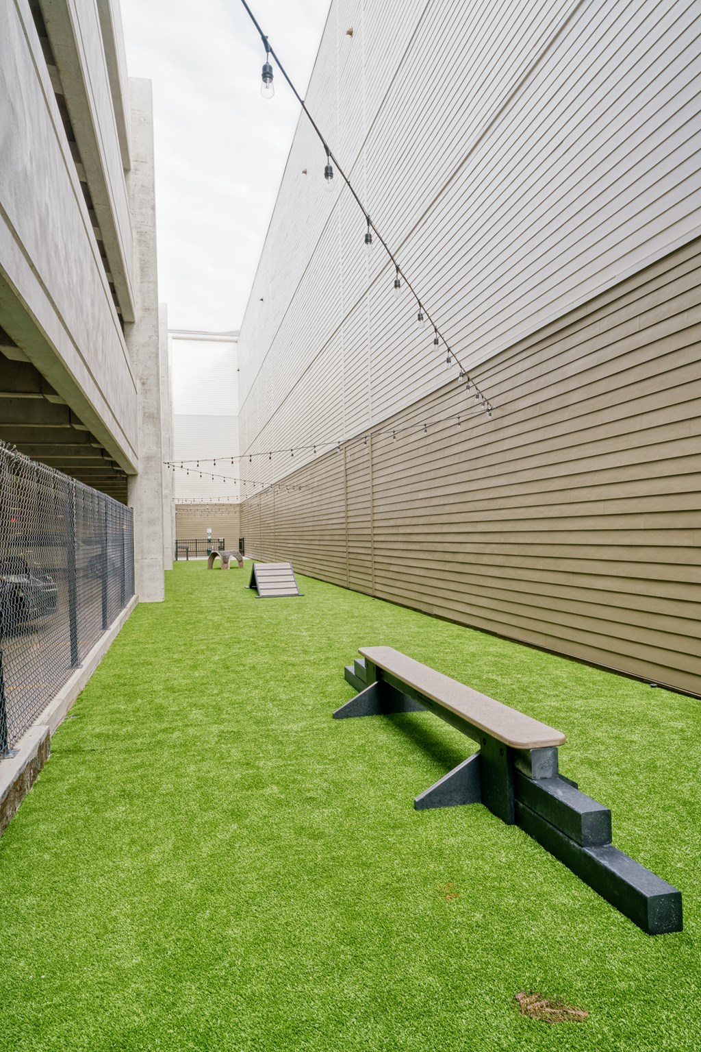 a courtyard with a bench and a fence at Lyric at Norton Commons Apartments, Prospect, Kentucky, 40059