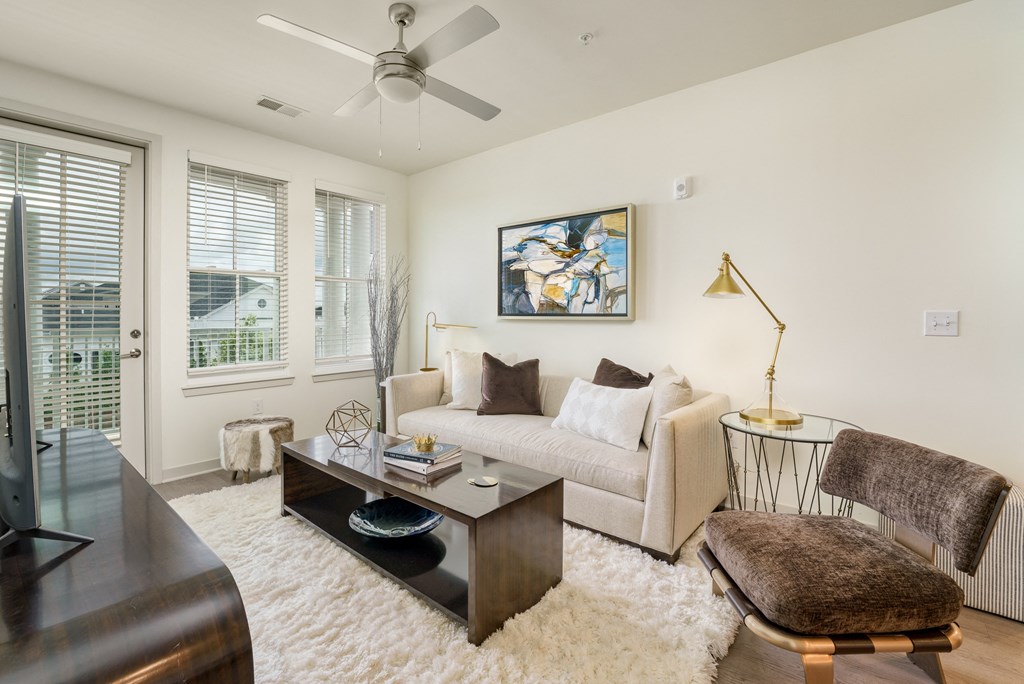 a living room with a couch and a coffee table at Lyric at Norton Commons Apartments, Prospect, Kentucky