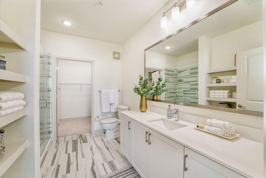 a bathroom with a large mirror and a toilet and a shower at Lyric at Norton Commons Apartments, Prospect, 40059