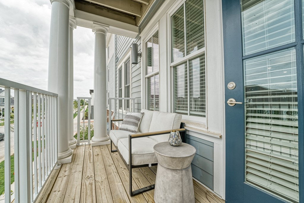 a porch with a couch and a table on it at Lyric at Norton Commons Apartments, Prospect, KY, 40059