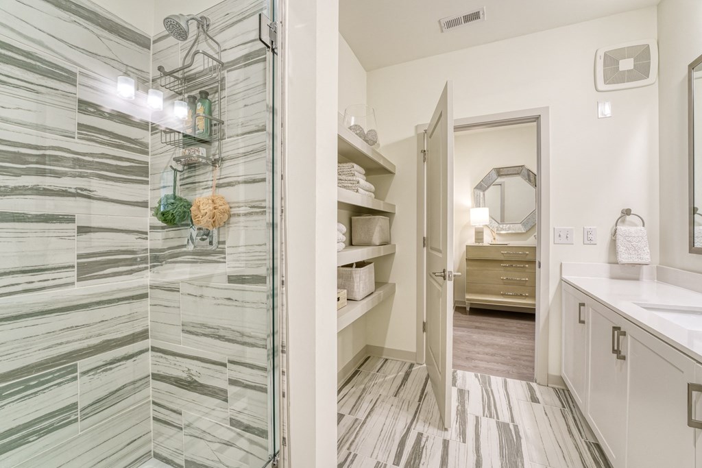 a bathroom with a shower and a sink and a mirror at Lyric at Norton Commons Apartments, Prospect, Kentucky, 40059