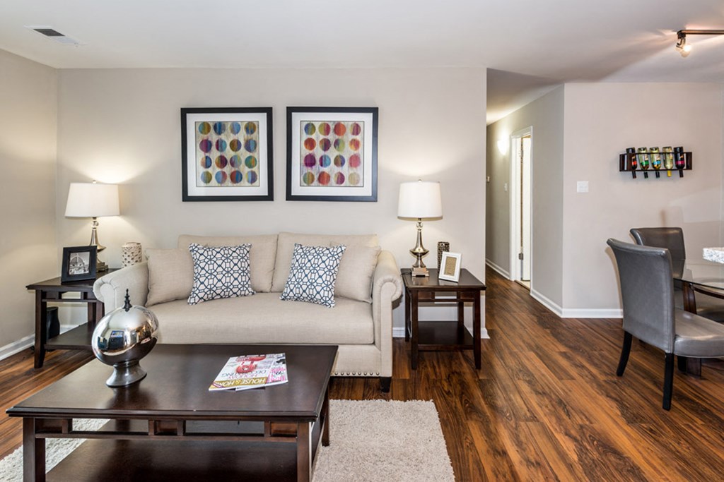a living room filled with furniture and a large window at Misty Ridge Apartments, Woodbridge, VA