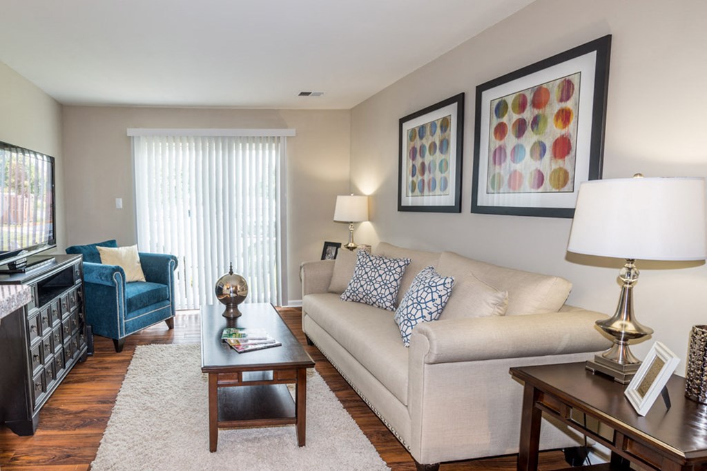 a living room filled with furniture and a large window at Misty Ridge Apartments, Woodbridge Virginia