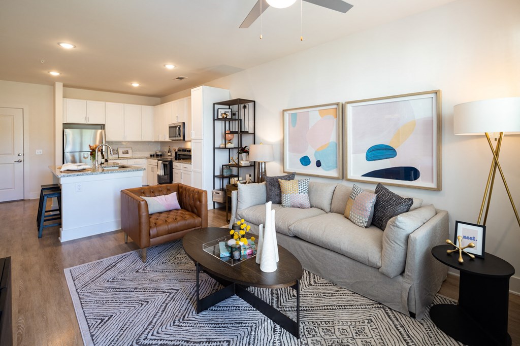 a living room with a couch and a table at The Quincy Apartments, Georgia