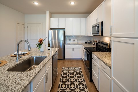 a view of a living room with a table and a vase at The Quincy Apartments, Acworth, GA, 30102