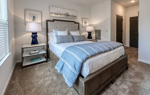 a bedroom with a large bed and two night stands at Retreat at Arden Farms, Arden, NC 28704