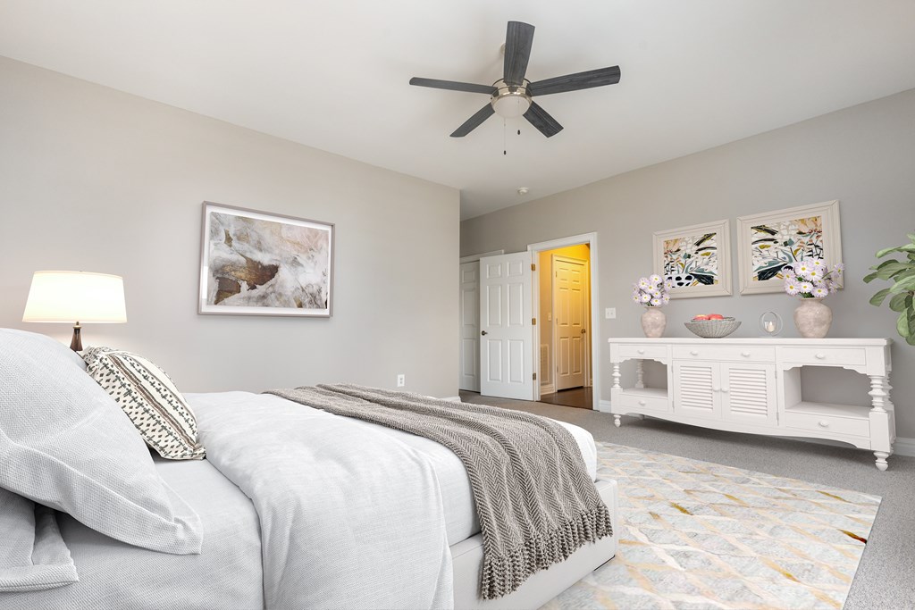 A bedroom with a bed, a fan, and a painting on the wall  at Sterling Manor, Williamsburg, VA, 23185