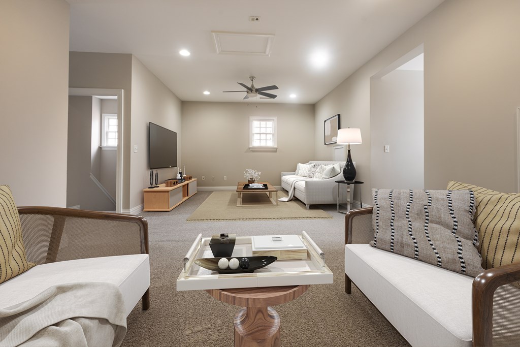 A living room with a couch, chair, and coffee table  at Sterling Manor, VA, 23185