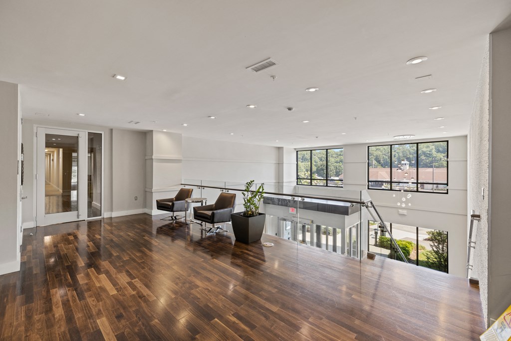 a large living room with hardwood floors and white walls at Rivergate, Woodbridge, VA, 22191