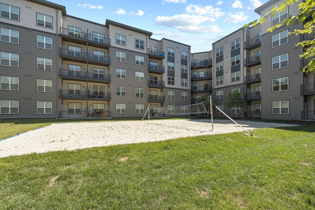 a volleyball court at the flats at big tex apartments in san antonio, tx at Rivergate, Woodbridge, 22191