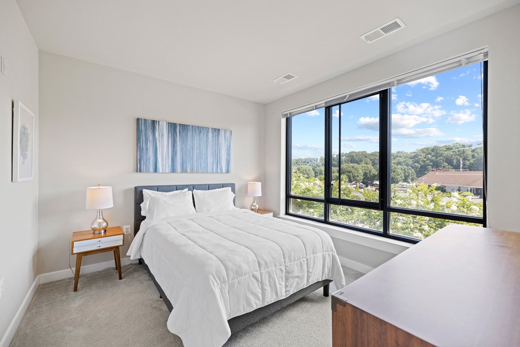 a bedroom with a bed and a large window at Rivergate, Virginia