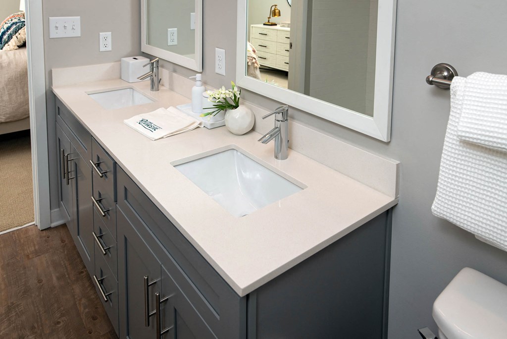a bathroom with a sink and a mirror at One Riverside Apartments, Tennessee, 37403