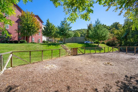a fenced in area with trees and a fence at Skyloft, Asheville, NC 28803