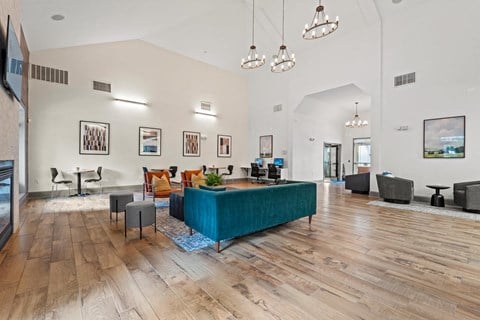 a living room with a blue couch in the middle