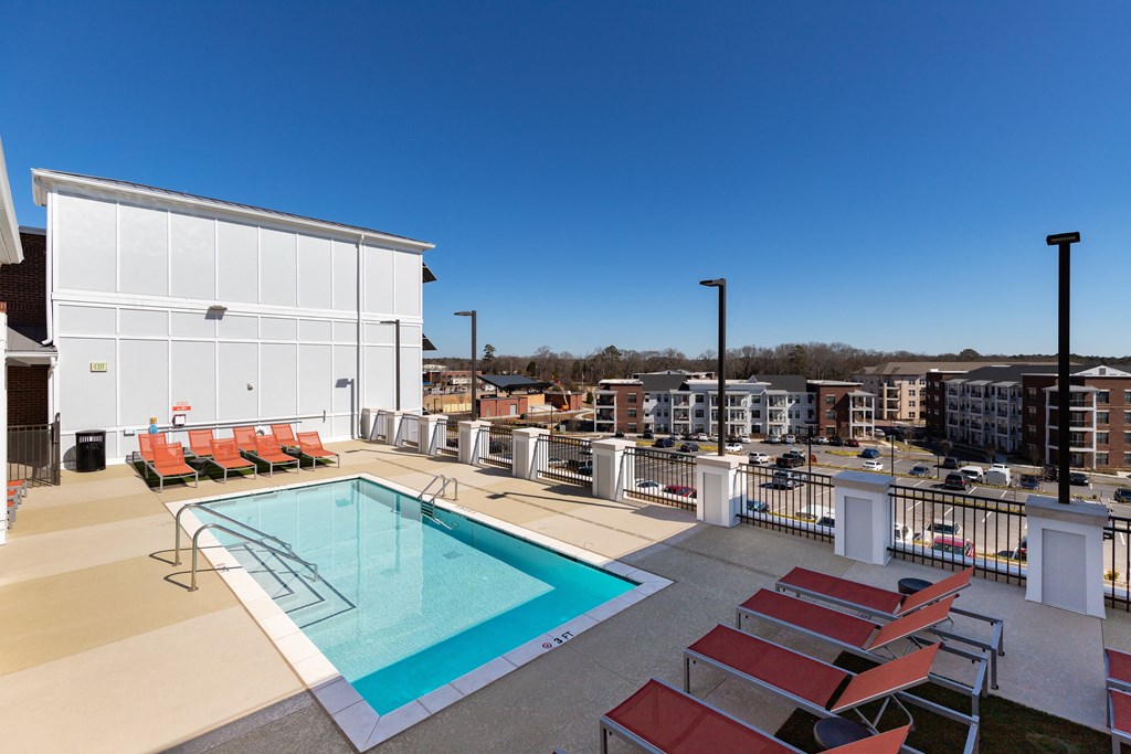 a view of the pool at homewood suites by hilton houston stafford sugar at The Flats at Southlawn Apartments, Lawrenceville, GA