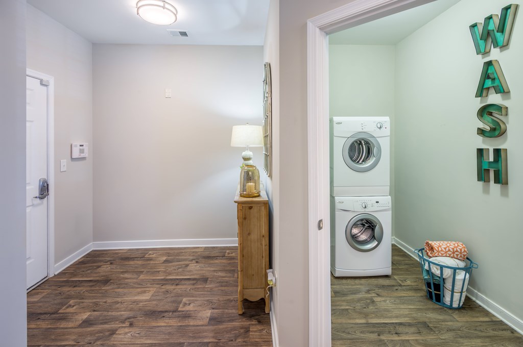 A laundry room with a washer and dryer  at Sterling Manor, Williamsburg