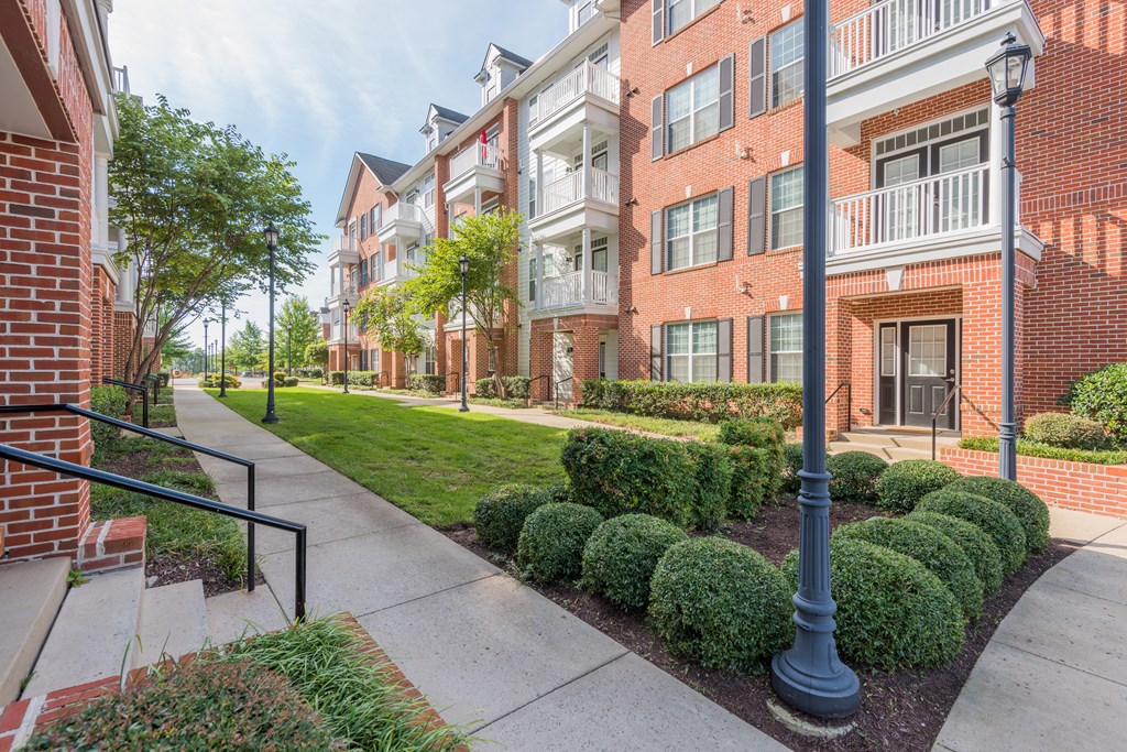 A street view of a residential area with apartment buildings  at Sterling Manor, Williamsburg, VA, 23185