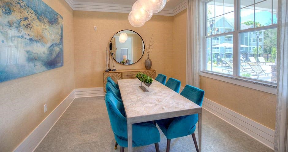 a dining room with a table and chairs and a mirror  at Lullwater at Big Ridge, Hixson, TN