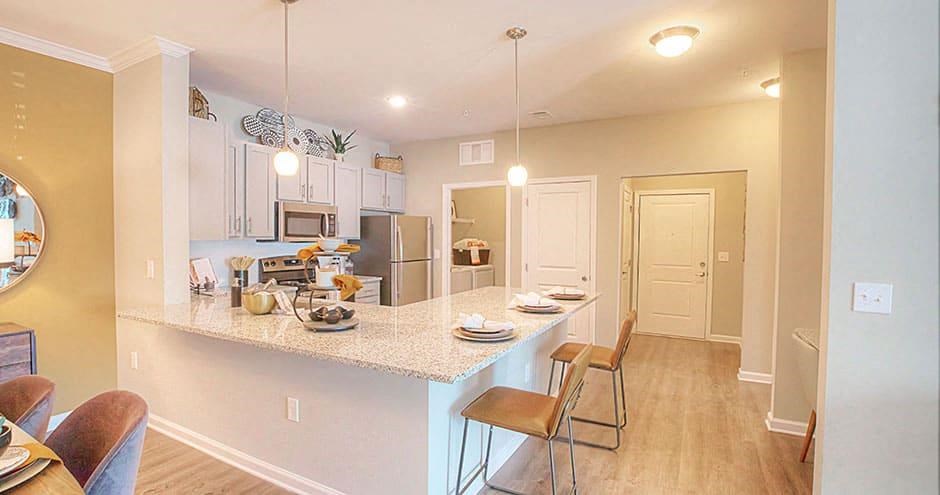 a kitchen with a counter top and a table  at Lullwater at Big Ridge, Hixson, TN, 37343