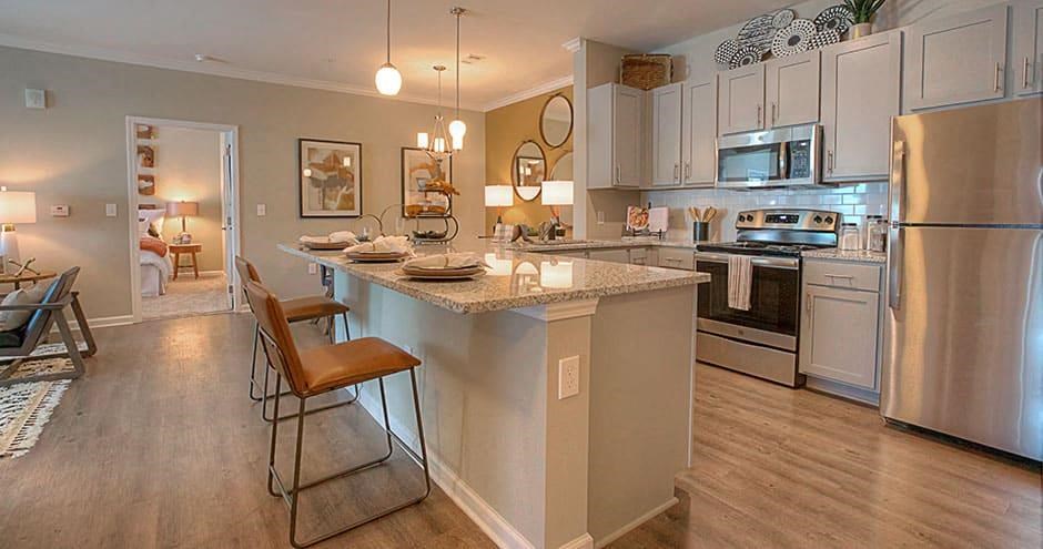 a kitchen with a center island and stainless steel appliances  at Lullwater at Big Ridge, Hixson