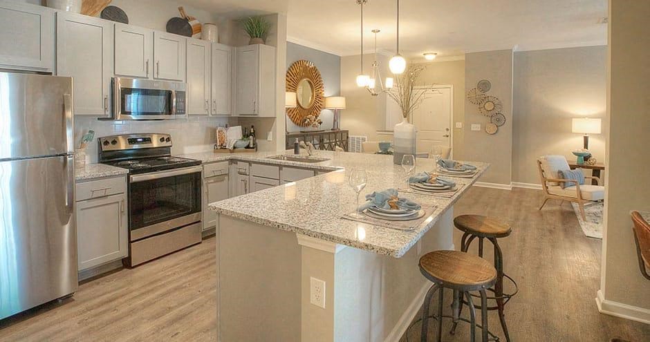 a kitchen with a marble counter top  at Lullwater at Big Ridge, Hixson, TN, 37343