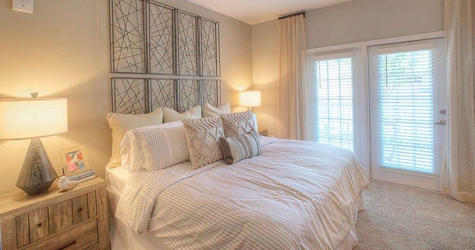 a bedroom with a large bed and a window  at Lullwater at Big Ridge, Hixson