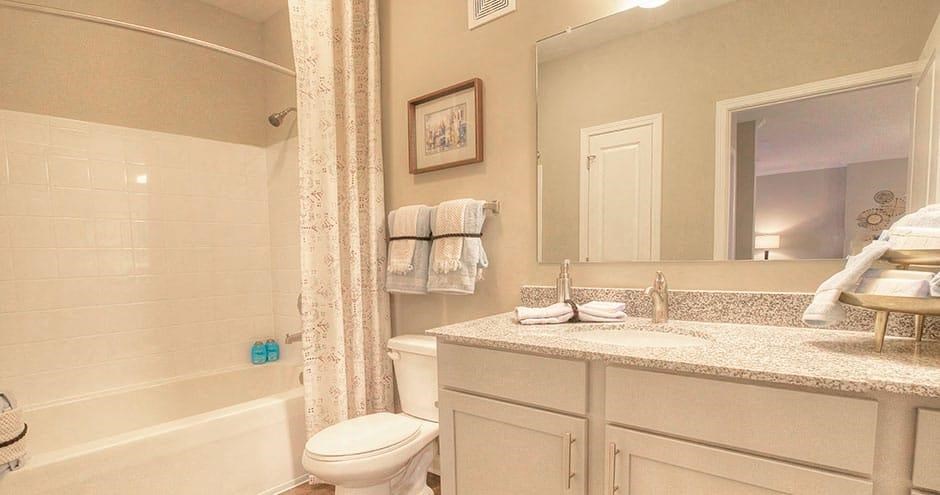 a bathroom with a sink toilet and a mirror  at Lullwater at Big Ridge, Hixson, Tennessee